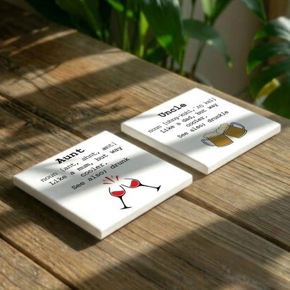 two white coasters with humorous definitions of an uncle and an aunt, accompanied by illustrations of beer glasses and mugs.