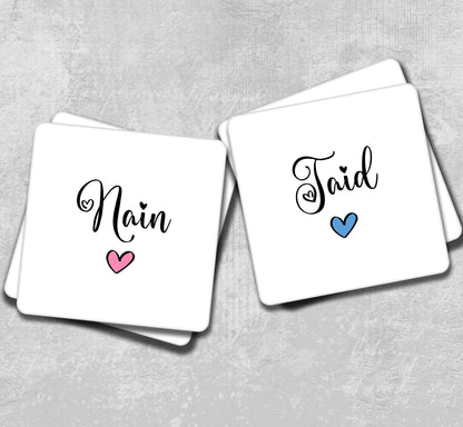 two coasters with the word main and a heart