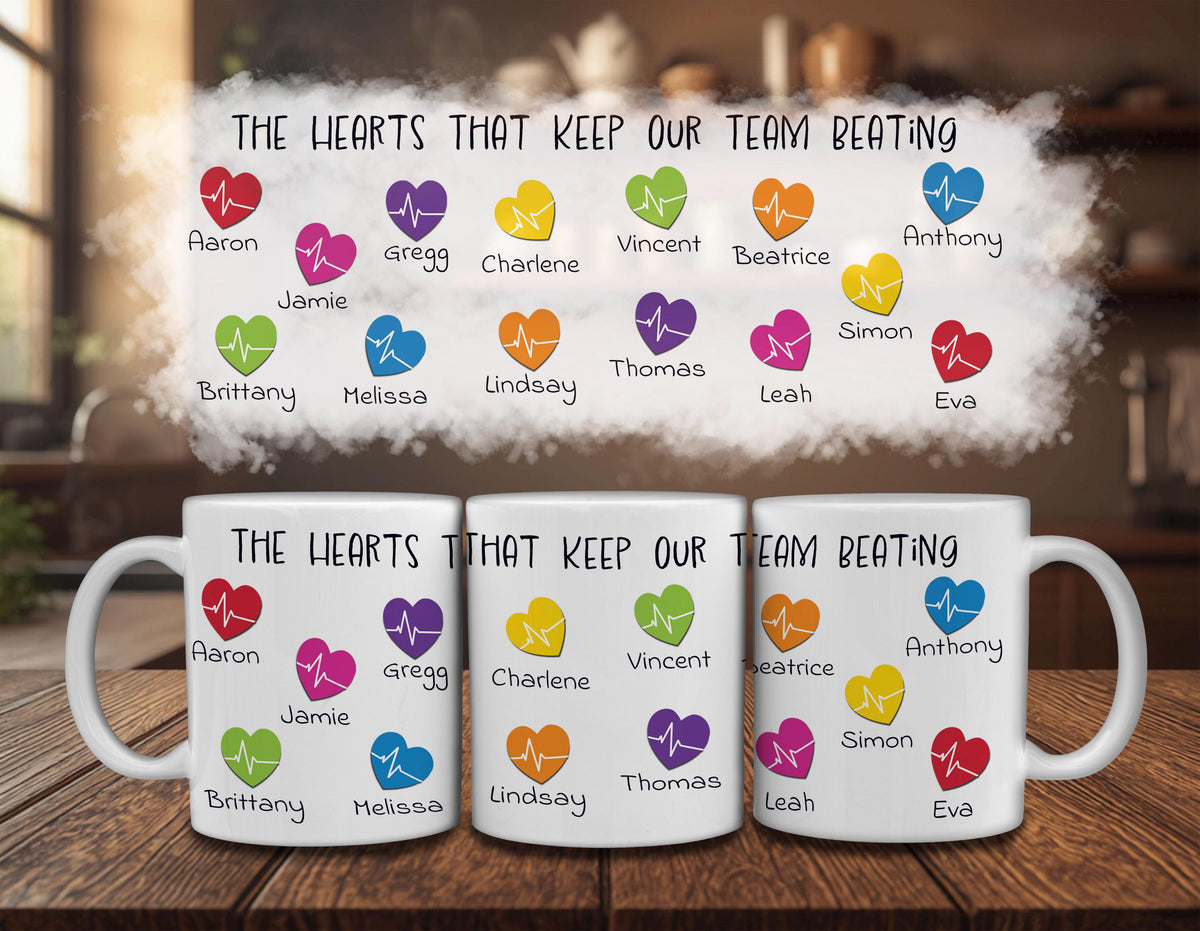 three white mugs with colorful heart-shaped icons and text printed on them. The text on the mugs reads "The hearts that keep our team beating" and lists the names of various people associated with the mugs.