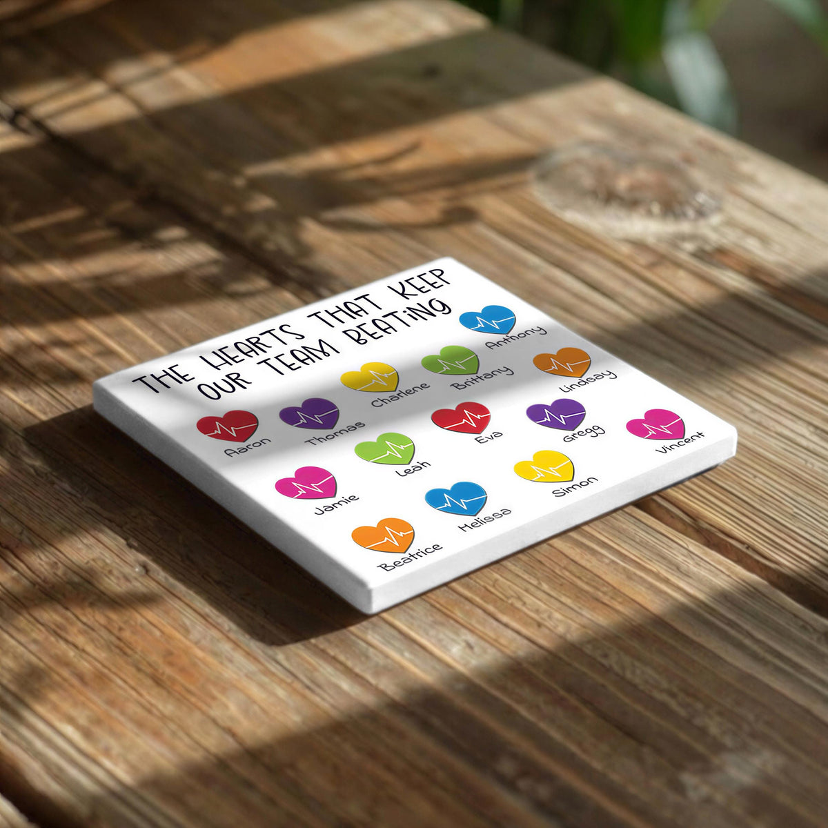 The image is a white square with a message about the hearts of a team, featuring colorful heart symbols and names of team members.