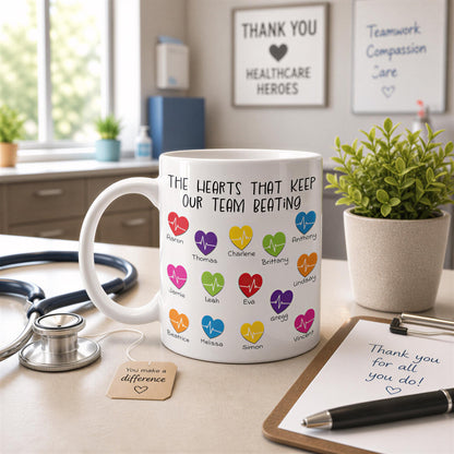 a white mug with colorful heart-shaped icons and text, placed on a desk with a stethoscope, a clipboard, and a plant.
