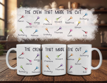three white mugs with colorful scissors printed on them, along with the text "The crew that made the cut" written above each mug.